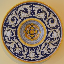 PLATE “GIRALI FIORITI" WITH MASKS AND DOLPHINS FROM 50
